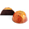 passion fruit and honey dark chocolate bonbon cut to show filling  